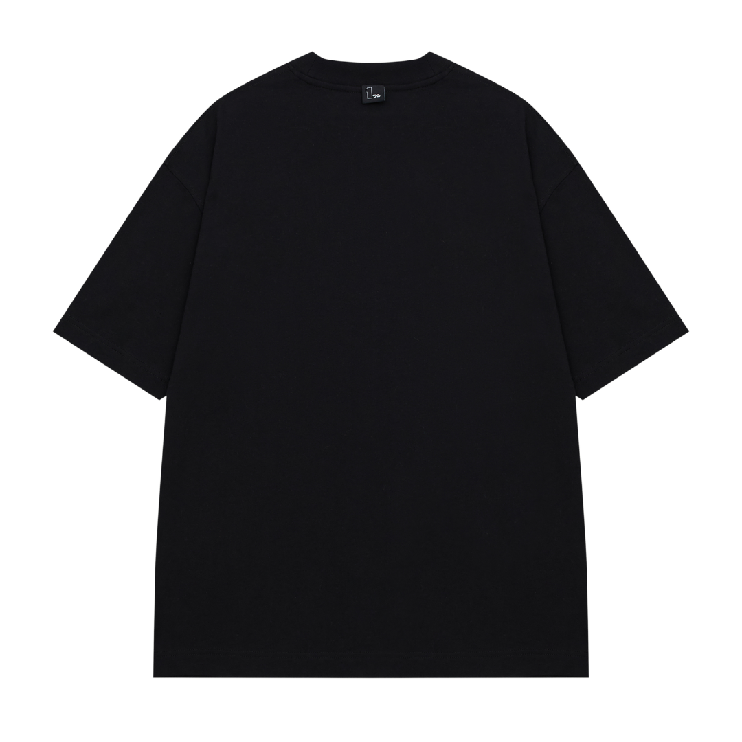 A black 1% club oversized t-shirt with a minimalist streetwear design, displayed against a transparent background. The t-shirt features a small black tag on the collar  with the text '1%' and an arched phrase that reads 'THE ONE PERCENT CLUB.' The relaxed fit, dropped shoulders, and premium fabric create a modern and stylish silhouette. The clean aesthetic and neutral colour make it versatile for casual wear, high-end street fashion, and luxury minimalist apparel.